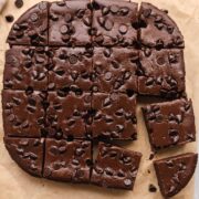 sliced brownies with chocolate chips on parchment paper.
