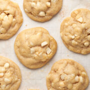 vegan white chocolate chip macadamia cookies on baking tray.