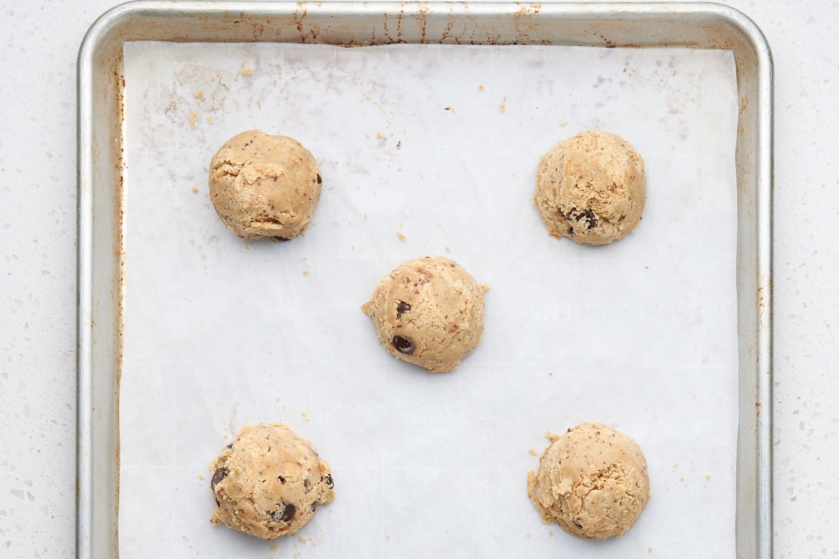 scoops of cookie dough on baking sheet.