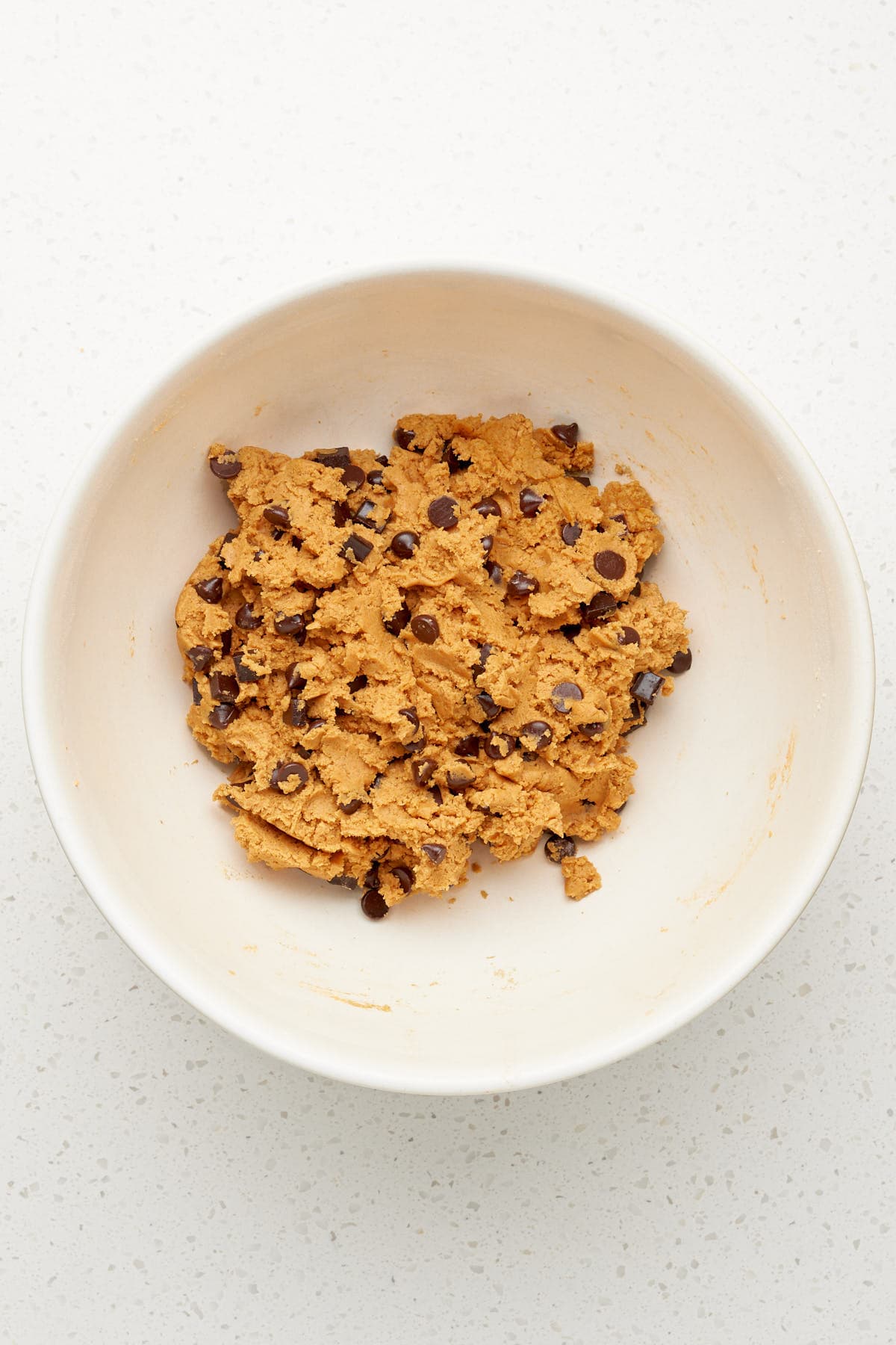 pumpkin chocolate chip cookie dough in a bowl.