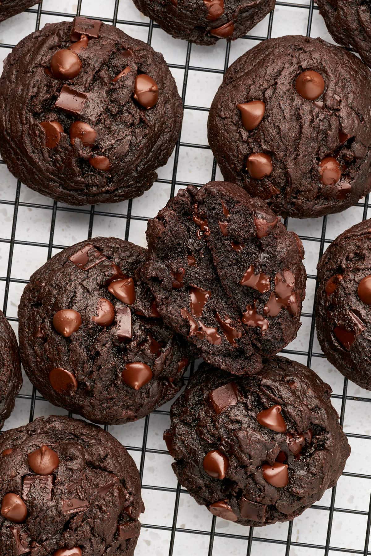 vegan chocolate chocolate chip cookies on a cooling rack.